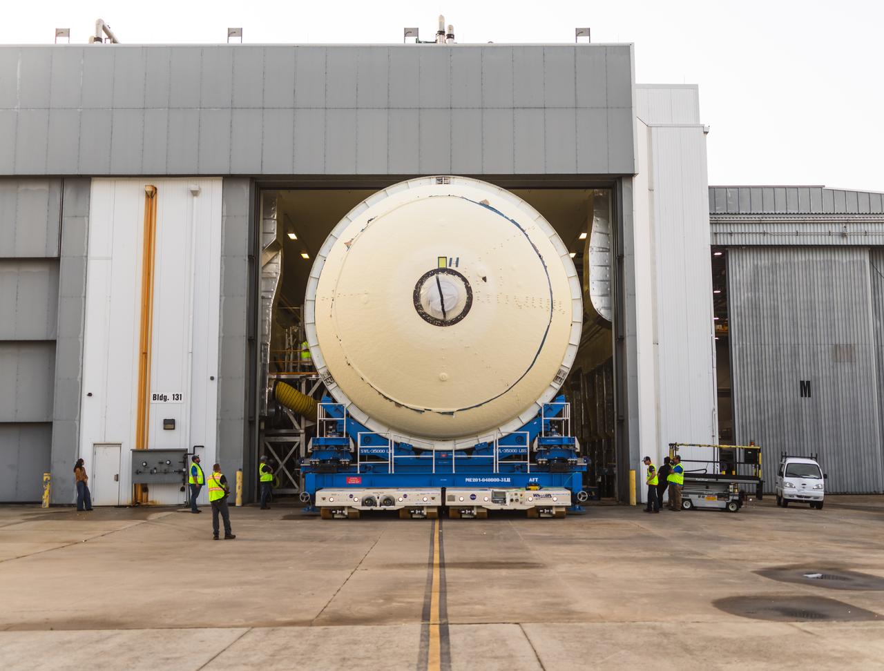 Teams at NASA’s Michoud Assembly Facility in New Orleans move a liquid hydrogen tank for the agency’s SLS (Space Launch System) rocket into the factory’s final assembly area on April 22. Having recently completed application of the thermal protection system, teams will now continue outfitting the 130-foot-tall tank with critical systems to ready it for its designated Artemis III mission. The propellant tank is one of five major elements that make up the 212-foot-tall rocket stage. The core stage, along with its four RS-25 engines, produce more than two million pounds of thrust to help launch NASA’s Orion spacecraft, astronauts, and supplies beyond Earth’s orbit and to the lunar surface for Artemis.